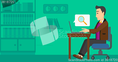 Image of Man working in office.