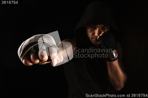 Image of Close-up hand of muscular man with bandage