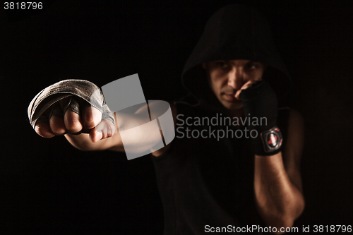 Image of Close-up hand of muscular man with bandage