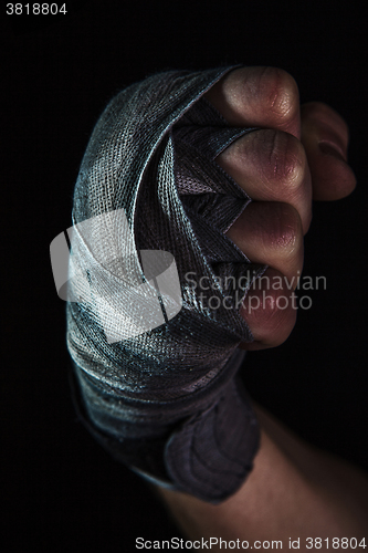 Image of Close-up hand of muscular man with bandage