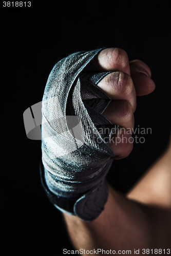 Image of Close-up hand of muscular man with bandage