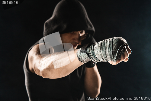 Image of Close-up hand of muscular man with bandage