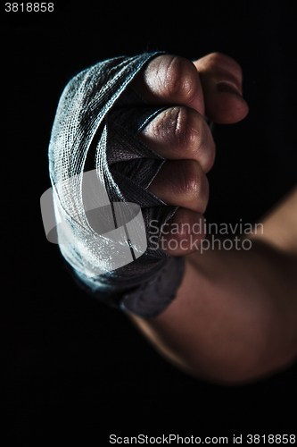 Image of Close-up hand of muscular man with bandage