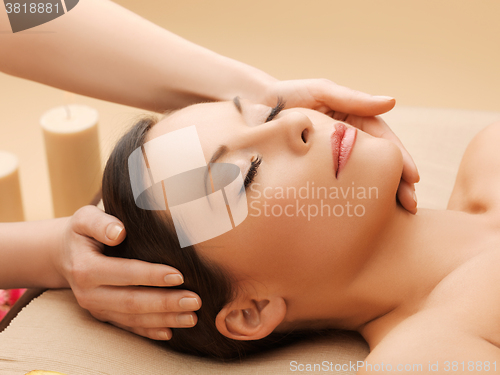 Image of beautiful woman in massage salon