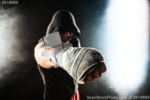 Image of Close-up hand of muscular man with bandage