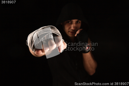 Image of Close-up hand of muscular man with bandage