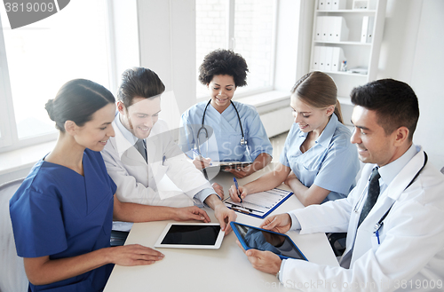 Image of group of happy doctors meeting at hospital office