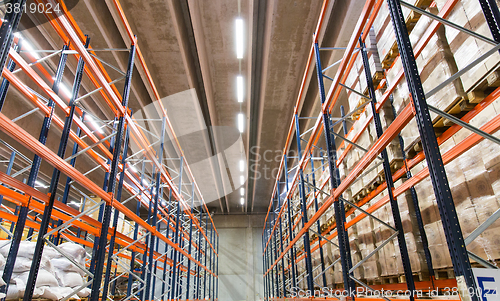 Image of cargo boxes storing at warehouse shelves