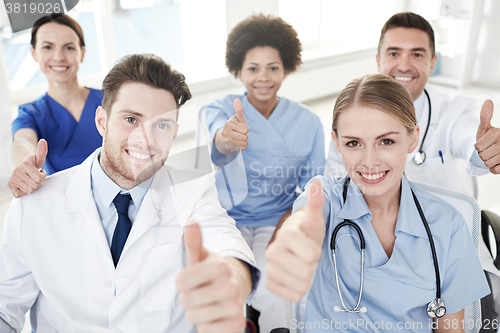 Image of group of happy doctors on seminar at hospital