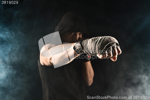 Image of Close-up hand of muscular man with bandage