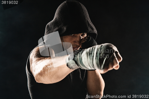 Image of Close-up hand of muscular man with bandage