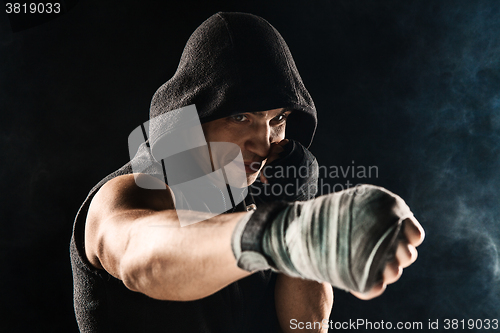 Image of Close-up hand of muscular man with bandage