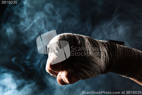 Image of Close-up hand of muscular man with bandage