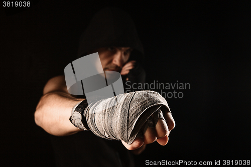 Image of Close-up hand of muscular man with bandage