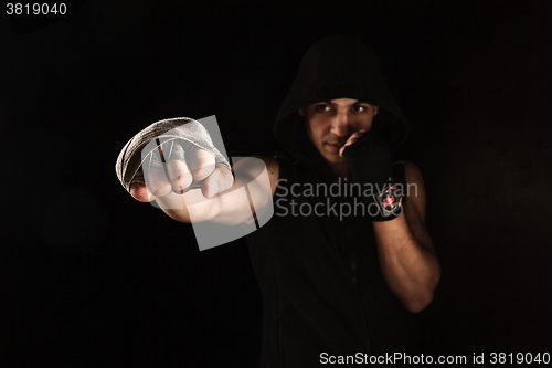 Image of Close-up hand of muscular man with bandage