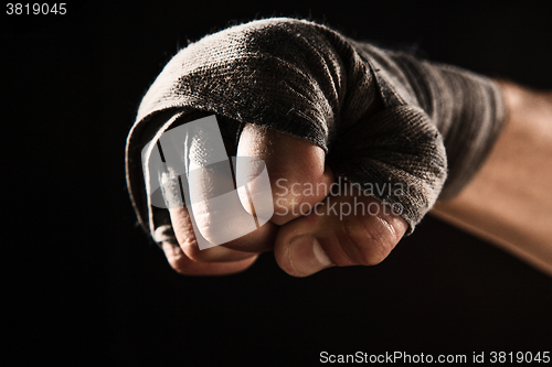 Image of Close-up hand of muscular man with bandage