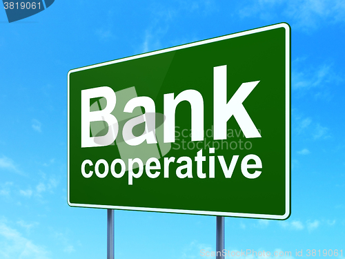 Image of Currency concept: Bank Cooperative on road sign background