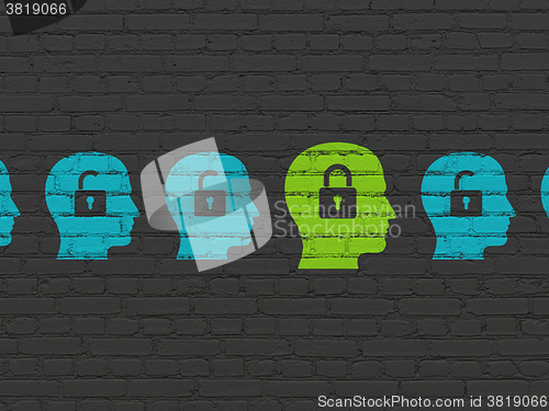 Image of Privacy concept: head with padlock icon on wall background