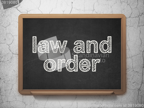 Image of Law concept: Law And Order on chalkboard background