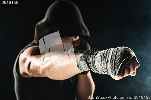 Image of Close-up hand of muscular man with bandage