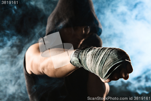 Image of Close-up hand of muscular man with bandage