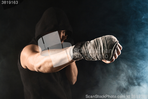 Image of Close-up hand of muscular man with bandage