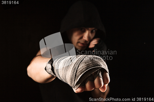 Image of Close-up hand of muscular man with bandage