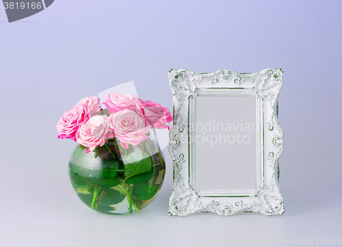 Image of Flowers vase and vintage frame 