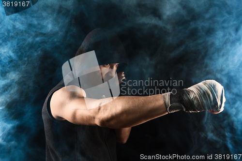 Image of Close-up hand of muscular man with bandage