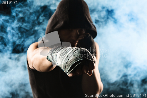 Image of Close-up hand of muscular man with bandage