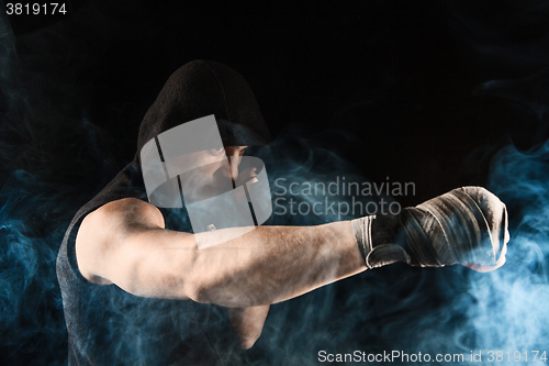 Image of Close-up hand of muscular man with bandage