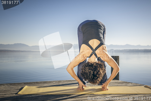 Image of yoga woman lake