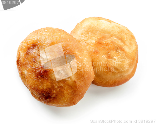 Image of two meat pies belyashi on white background