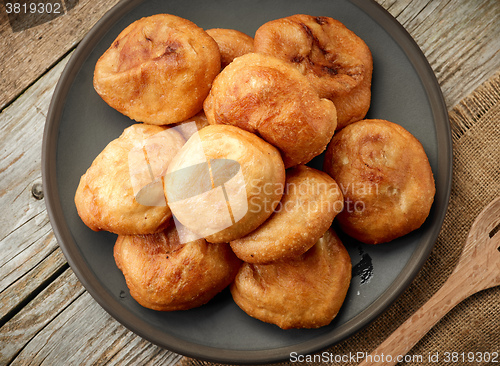 Image of fried meat pies on dark plate
