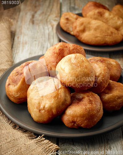 Image of fried meat pies on dark plate