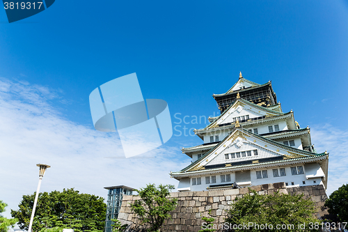 Image of Osaka castle in Japan with clear blue sky