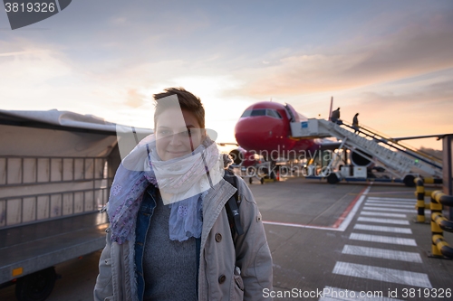 Image of Young woman and airplane