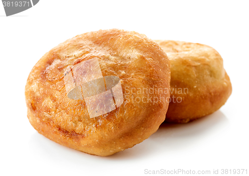 Image of two meat pies belyashi on white background