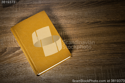 Image of Yellow book on the table