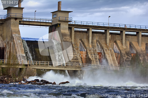 Image of Powerful water discharge through gate of power plant