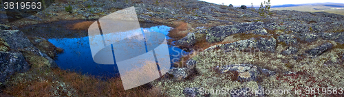 Image of Eye of the North. Blue small lake among mountain tundra.