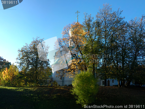 Image of Golden autumn. Yellow trees and Russian Church