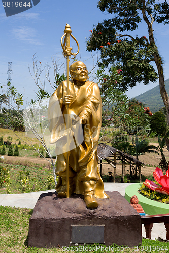 Image of fat monk statue in complex Pagoda Ekayana