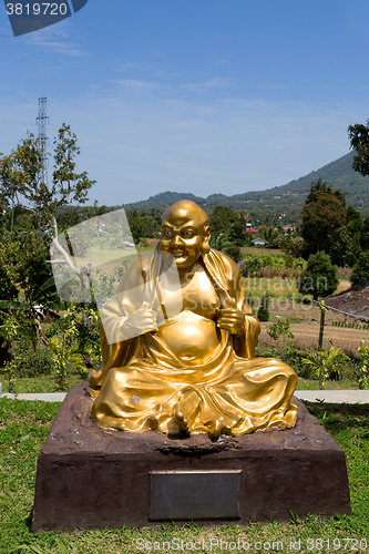 Image of fat monk statue in complex Pagoda Ekayana