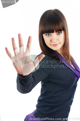 Image of Pretty girl shows stop gesture