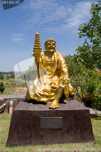Image of fat monk statue in complex Pagoda Ekayana