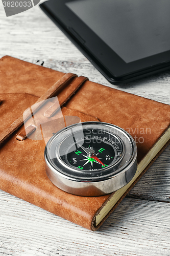 Image of compass and tablet