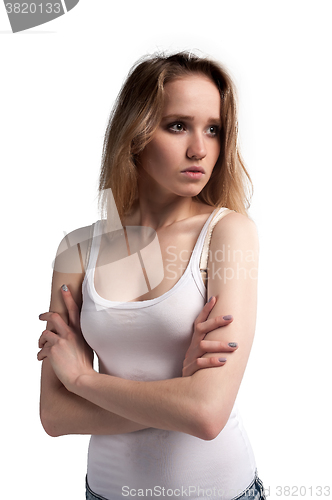 Image of Attractive sad woman in white vest
