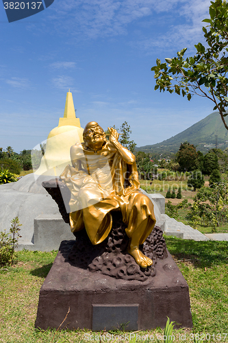 Image of fat monk statue in complex Pagoda Ekayana