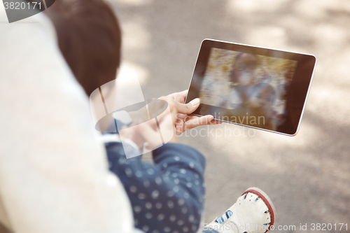 Image of Family with digital tablet